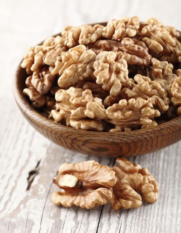 Walnuts in a wooden plate