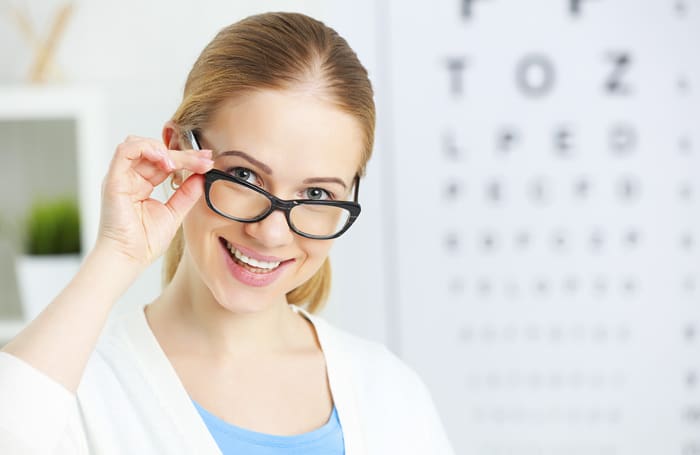eyesight check. woman in glasses at the doctor ophthalmologist optician